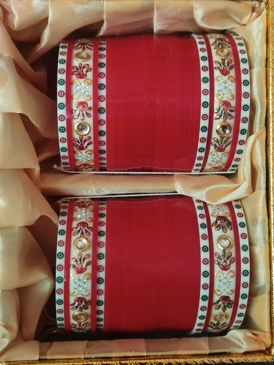 Traditional red chooda with hand-painted kangans