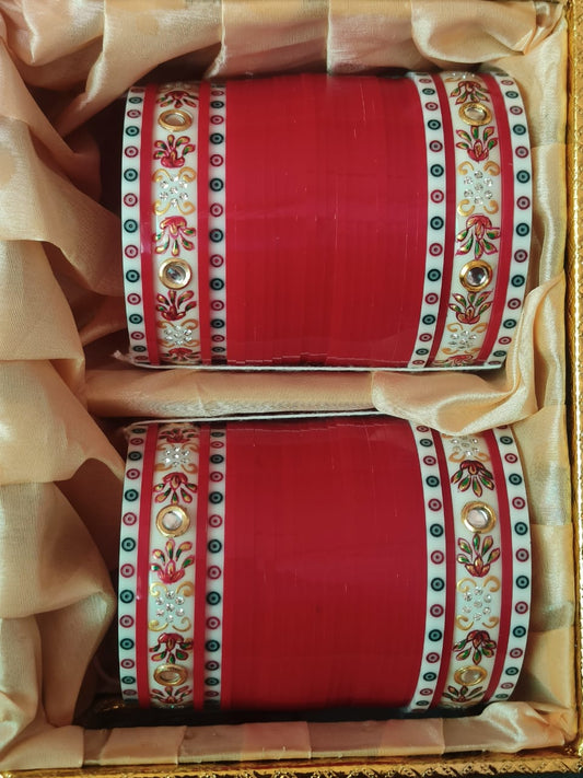 Traditional red chooda with hand-painted kangansbrac